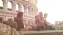 Group of young people taken pictures infront of the colosseum Rome