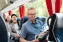 Relaxed People reading magazines douring a city tour in a Irro bus